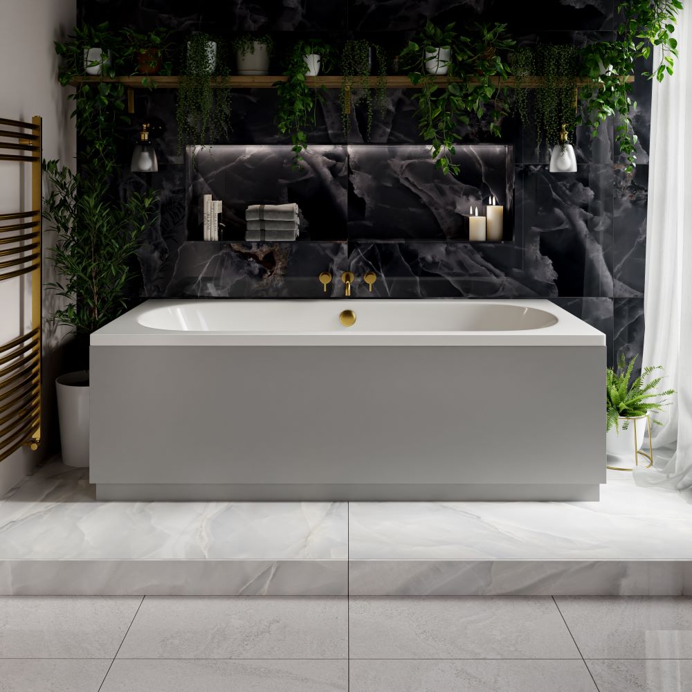 Back to wall bath with blue marble tiles, brass hardware and greenery