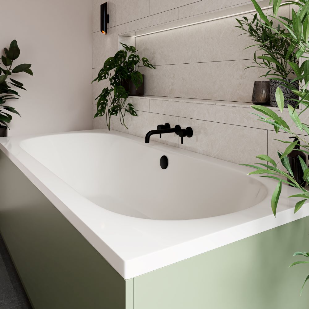 Double ended bath with olive green panel and black wall mounted taps