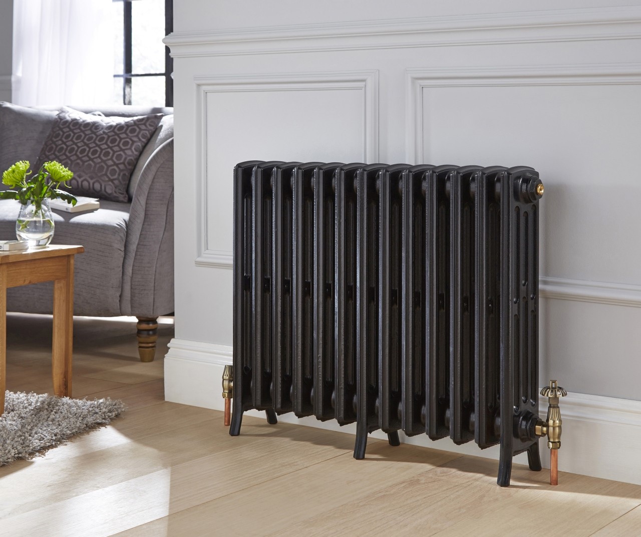 A black traditional floor standing radiator