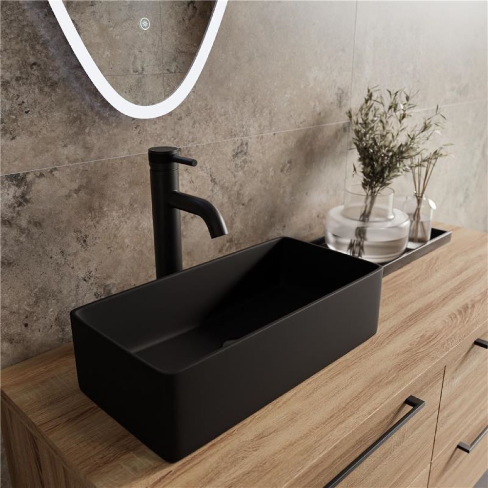 Black rectangular countertop basin with matching matt black tap