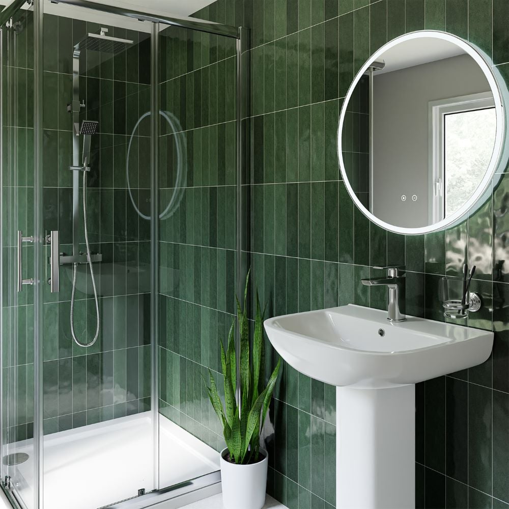 Green metro tiled bathroom with shower enclosure, sink and mirror